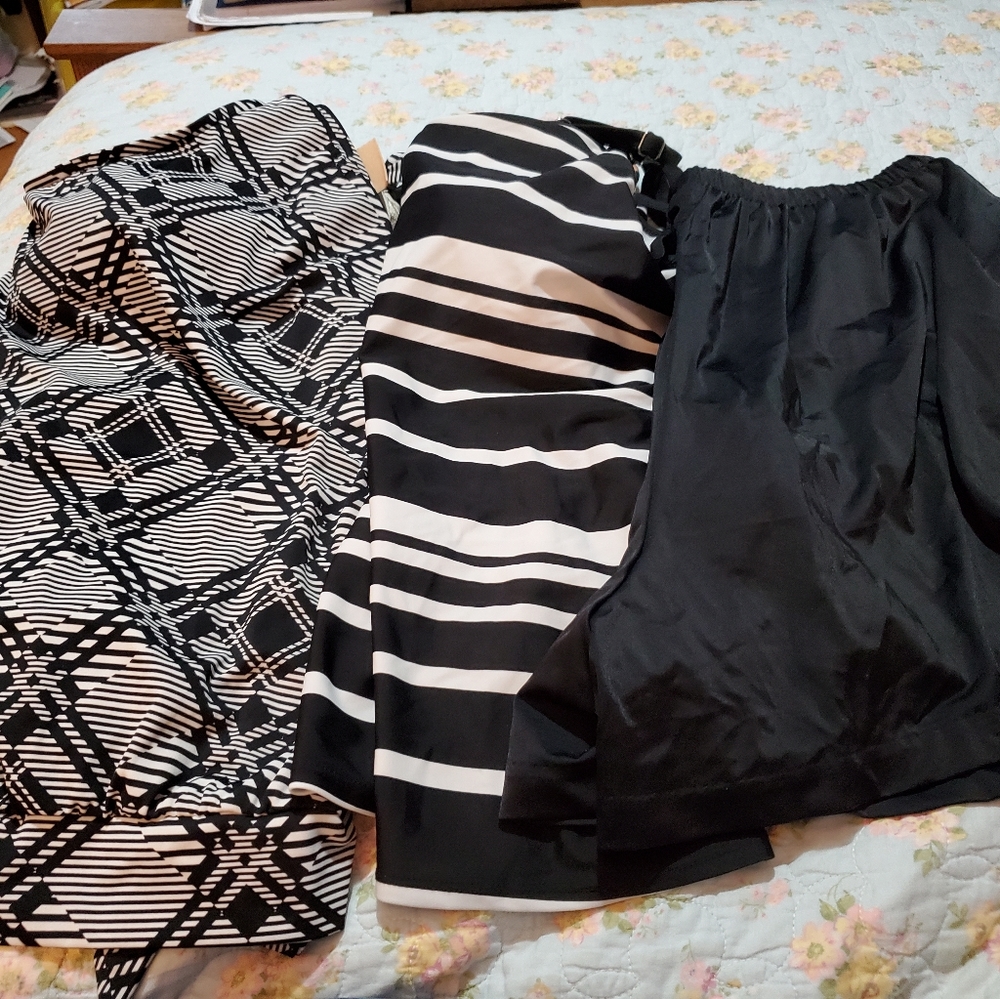2 swim tops and 1 pair swim shorts all sold as one lot